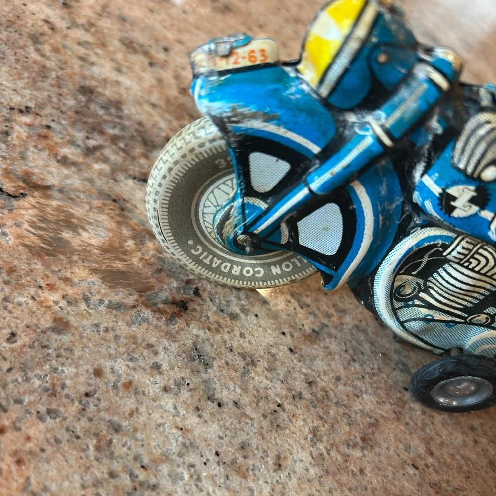 Tin Lithograph Friction Drive Ballon Cordatic toy cycle EN-12-63 Vtg 1950 Era.